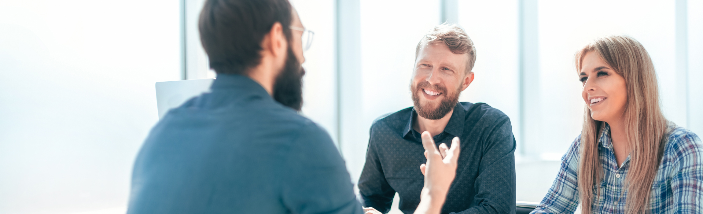 ny-46764977-group-of-business-people-sitting-at-the-office-table